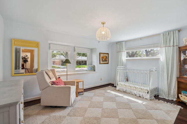 8019 Skyline Dr, Houston, TX 77063 - bedroom featuring multiple windows, wood finished floors, and baseboards
