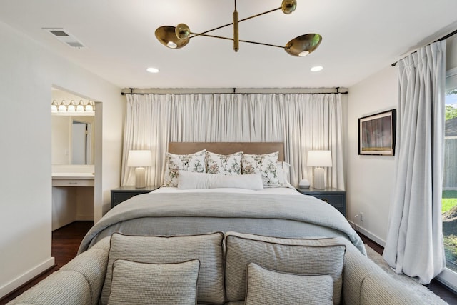 8019 Skyline Dr, Houston, TX 77063 - bedroom featuring wood finished floors, baseboards, ensuite bath, multiple windows, and recessed lighting