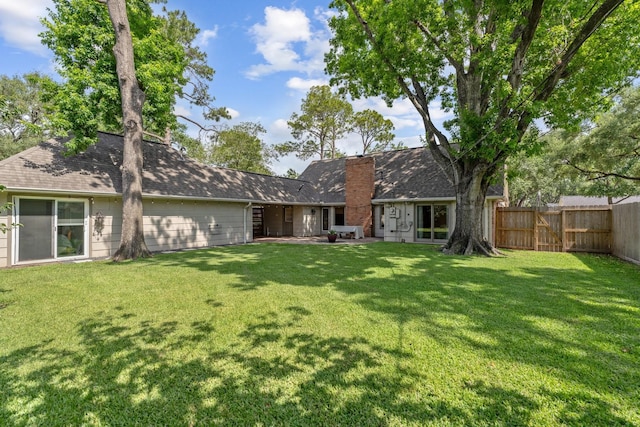 8019 Skyline Dr, Houston, TX 77063 - rear view of property with a chimney and a patio area