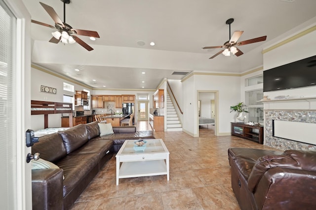 898 Mr G, Crystal Beach, TX 77650 - living room with ceiling fan, stairs, ornamental molding, a fireplace, and recessed lighting