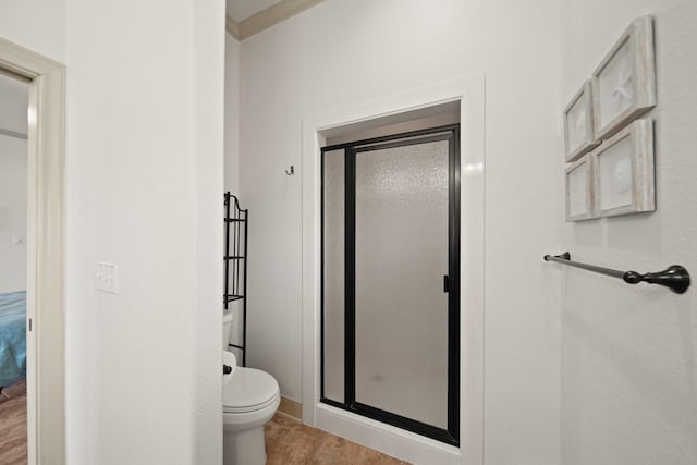 898 Mr G, Crystal Beach, TX 77650 - full bathroom with a stall shower, toilet, and baseboards