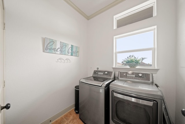 898 Mr G, Crystal Beach, TX 77650 - laundry area with washer and clothes dryer, ornamental molding, baseboards, and light tile patterned flooring