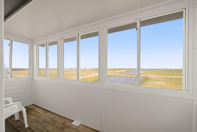 898 Mr G, Crystal Beach, TX 77650 - unfurnished sunroom featuring healthy amount of natural light, hardwood / wood-style flooring, and a water view