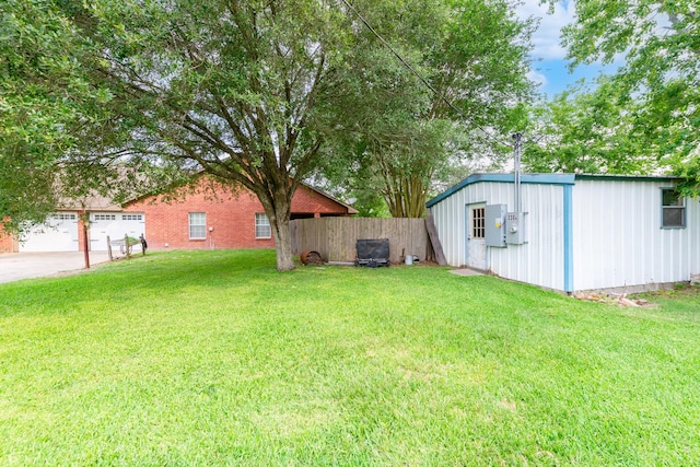 330 N 4th St, Beasley, TX 77417 - view of yard with a garage and an outdoor structure