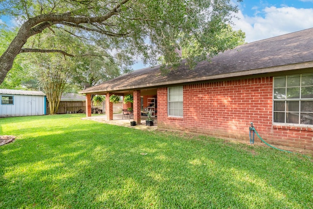 330 N 4th St, Beasley, TX 77417 - view of yard with a patio and an outbuilding