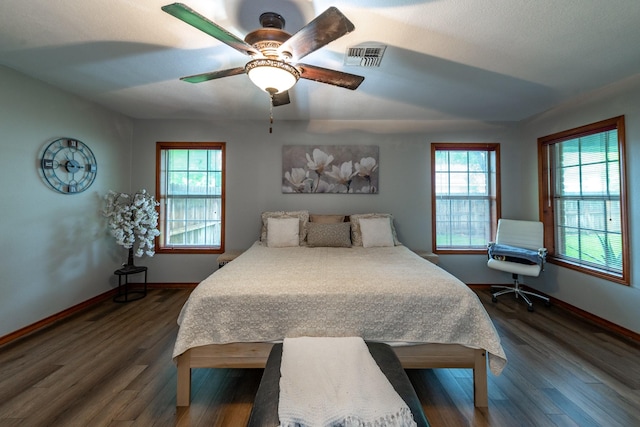 330 N 4th St, Beasley, TX 77417 - bedroom featuring dark wood-style flooring and a ceiling fan