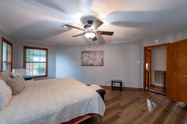 330 N 4th St, Beasley, TX 77417 - bedroom with wood finished floors and ceiling fan