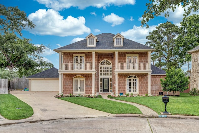 14102 N Suddley Castle St, Houston, TX 77095 - view of front of property featuring french doors, a balcony, brick siding, concrete driveway, and a garage