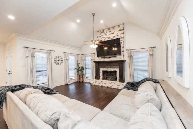 14102 N Suddley Castle St, Houston, TX 77095 - living area featuring lofted ceiling, wood finished floors, ceiling fan, a fireplace with raised hearth, and ornamental molding