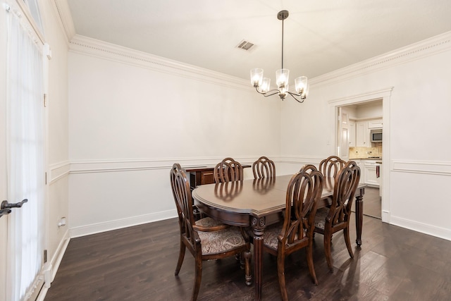 14102 N Suddley Castle St, Houston, TX 77095 - dining room featuring a chandelier, ornamental molding, wainscoting, dark wood-style floors, and baseboards