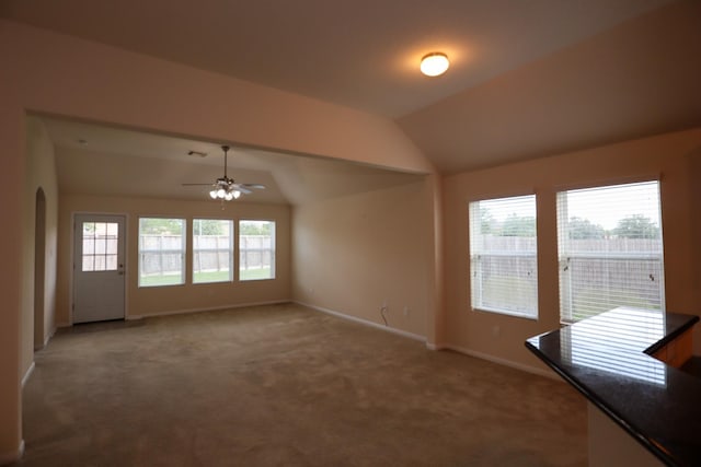 17907 Acorn Field Trl, Humble, TX 77346 - empty room featuring arched walkways, light carpet, baseboards, ceiling fan, and lofted ceiling