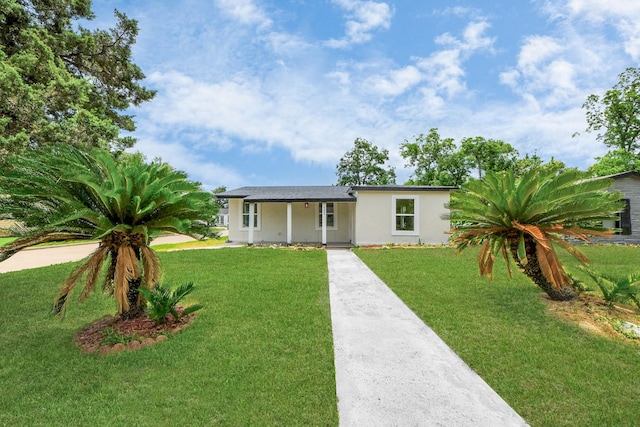 501 Schilling St, Baytown, TX 77520 - view of front of house with stucco siding, a front lawn, and concrete driveway