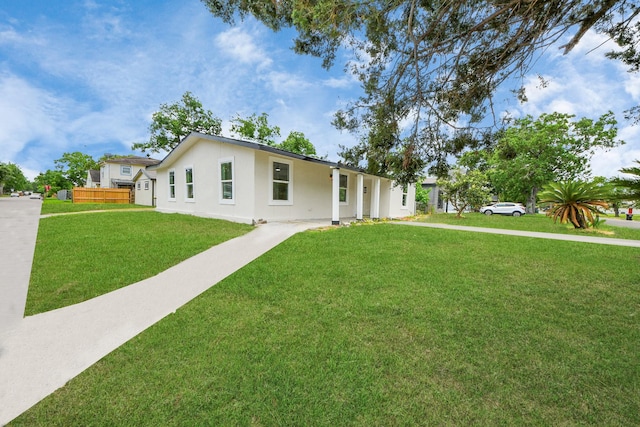 501 Schilling St, Baytown, TX 77520 - ranch-style house featuring a front lawn and stucco siding