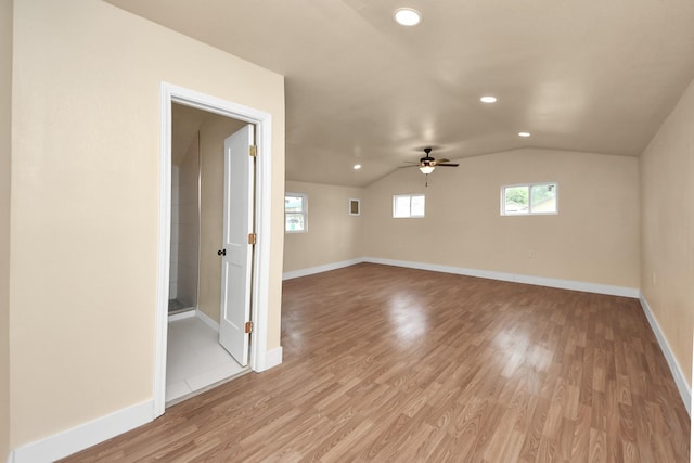 501 Schilling St, Baytown, TX 77520 - unfurnished room with vaulted ceiling, recessed lighting, light wood-type flooring, a ceiling fan, and baseboards