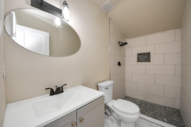501 Schilling St, Baytown, TX 77520 - bathroom with vanity, a tile shower, and toilet