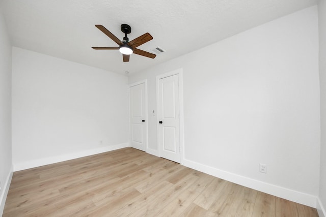 501 Schilling St, Baytown, TX 77520 - spare room with baseboards, ceiling fan, and light wood-style flooring