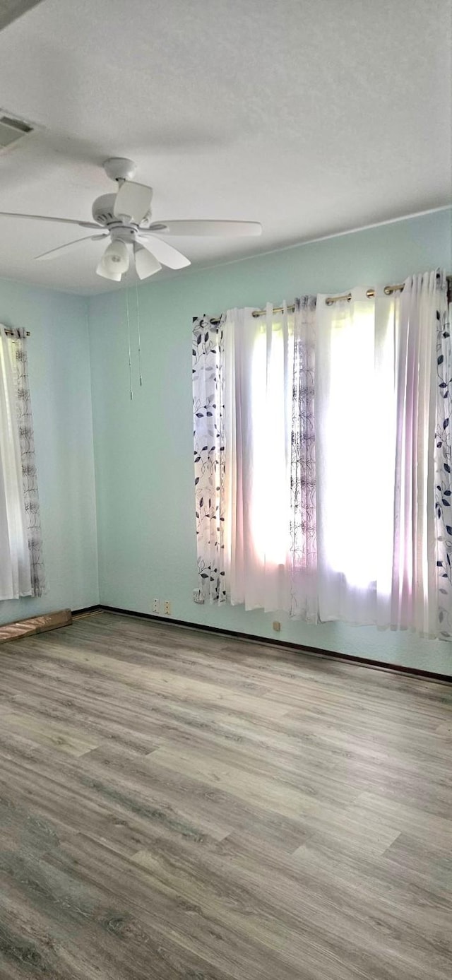3137 18th St, Port Arthur, TX 77642 - unfurnished room featuring a ceiling fan and wood finished floors