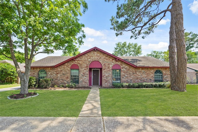 12839 Aste Ln, Houston, TX 77065 - ranch-style house featuring roof with shingles, brick siding, and a front yard