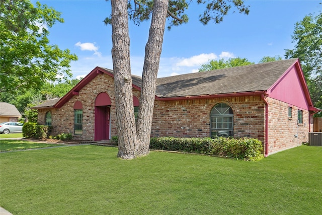 12839 Aste Ln, Houston, TX 77065 - view of front of property featuring brick siding, roof with shingles, central AC, and a front yard