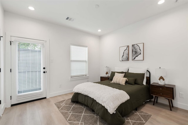 2522 Live Oak St, Houston, TX 77004 - bedroom with light wood-style flooring, recessed lighting, baseboards, and access to outside