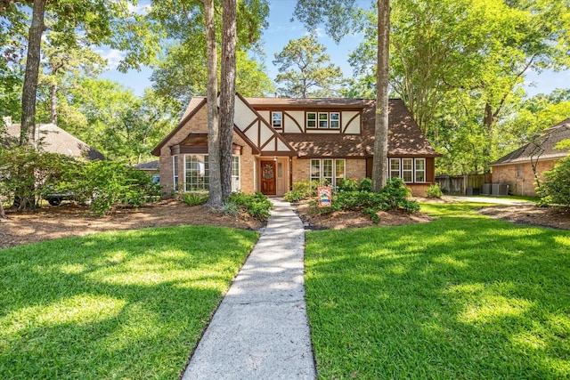 2055 Pine River Dr, Houston, TX 77339 - tudor home with brick siding