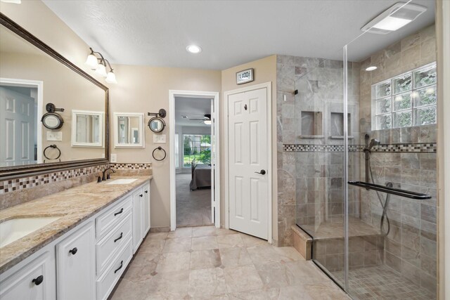 2055 Pine River Dr, Houston, TX 77339 - full bath featuring double vanity, tiled shower, ensuite bath, a ceiling fan, and recessed lighting