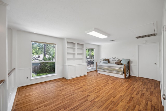 2055 Pine River Dr, Houston, TX 77339 - bedroom with light wood-style floors and attic access