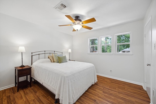2055 Pine River Dr, Houston, TX 77339 - bedroom with baseboards, wood finished floors, and a ceiling fan