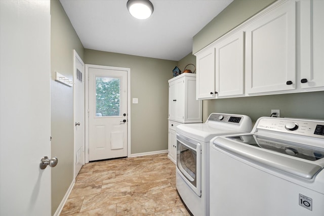 2055 Pine River Dr, Houston, TX 77339 - laundry area with cabinet space, washing machine and dryer, and baseboards