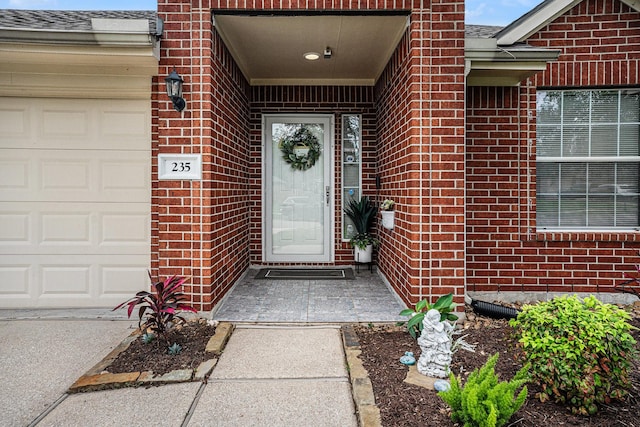 235 River Basin Ln, League City, TX 77539 - view of exterior entry featuring brick siding and a garage
