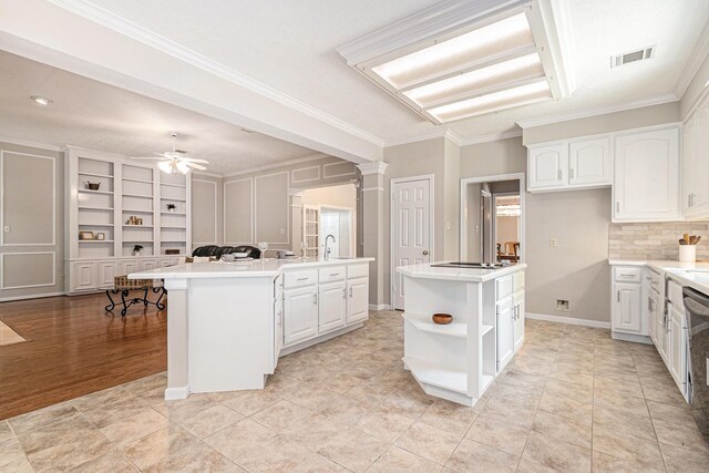 3506 Park Springs Ln, Houston, TX 77345 - kitchen featuring a kitchen island, open shelves, white cabinets, crown molding, and ceiling fan