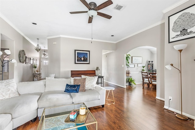 19715 Desna Dr, Porter, TX 77365 - living room featuring a ceiling fan, wood finished floors, arched walkways, baseboards, and crown molding