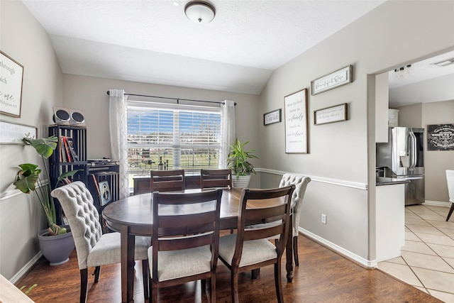 19715 Desna Dr, Porter, TX 77365 - dining space with lofted ceiling and baseboards