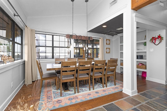 319 W Shore Dr, Kemah, TX 77565 - dining area featuring crown molding, a chandelier, baseboards, and built in shelves