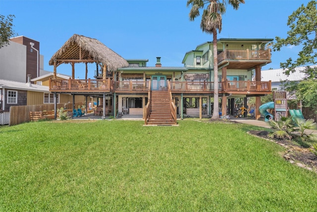 319 W Shore Dr, Kemah, TX 77565 - rear view of house featuring a wooden deck, stairs, a patio, and a gazebo