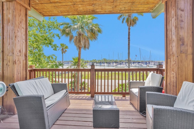 319 W Shore Dr, Kemah, TX 77565 - wooden terrace with an outdoor hangout area, a water view, and view of marina