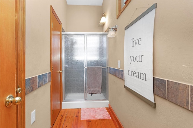 319 W Shore Dr, Kemah, TX 77565 - bathroom featuring a shower stall and wood finished floors