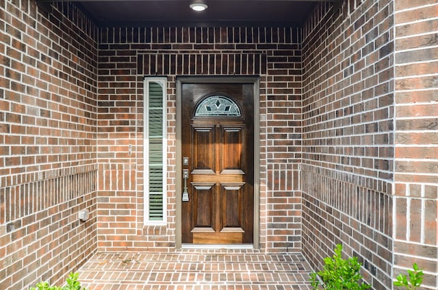 6523 Tuskegee St, Houston, TX 77091 - view of exterior entry featuring brick siding