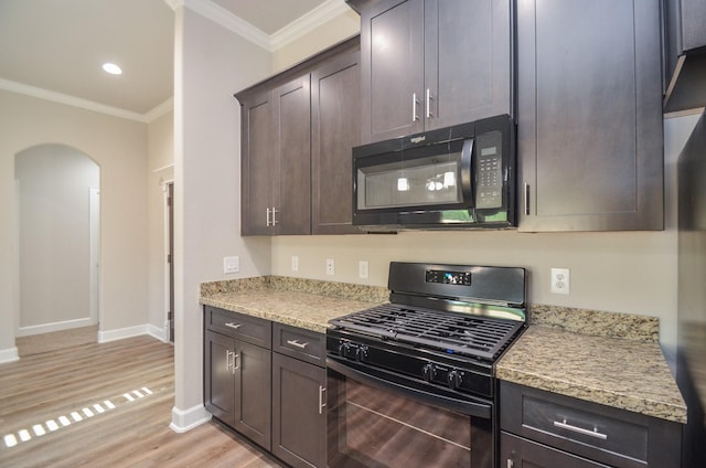 6523 Tuskegee St, Houston, TX 77091 - kitchen with black appliances, arched walkways, crown molding, light wood finished floors, and baseboards