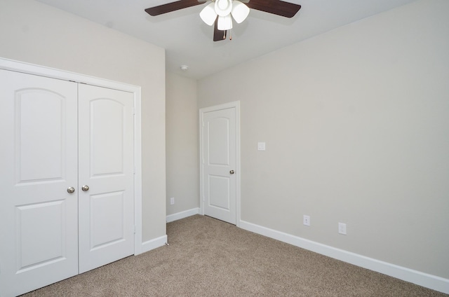 6523 Tuskegee St, Houston, TX 77091 - unfurnished bedroom featuring light carpet, baseboards, a closet, and a ceiling fan