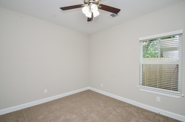 6523 Tuskegee St, Houston, TX 77091 - spare room featuring carpet, baseboards, and ceiling fan