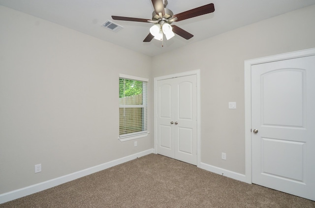 6523 Tuskegee St, Houston, TX 77091 - unfurnished bedroom featuring carpet floors, baseboards, a closet, and a ceiling fan