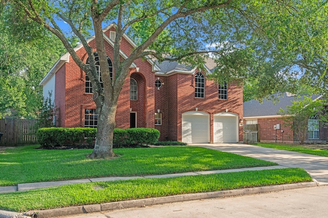1802 Moston Dr, Spring, TX 77386 - traditional home featuring concrete driveway, an attached garage, and brick siding