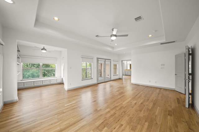 9714 Braesmont Dr, Houston, TX 77096 - unfurnished living room featuring ceiling fan, a raised ceiling, recessed lighting, light wood finished floors, and baseboards