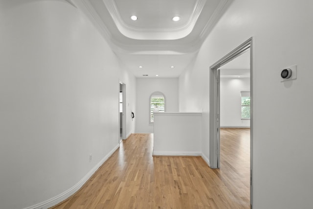 9714 Braesmont Dr, Houston, TX 77096 - hallway featuring light wood finished floors, recessed lighting, baseboards, a tray ceiling, and ornamental molding