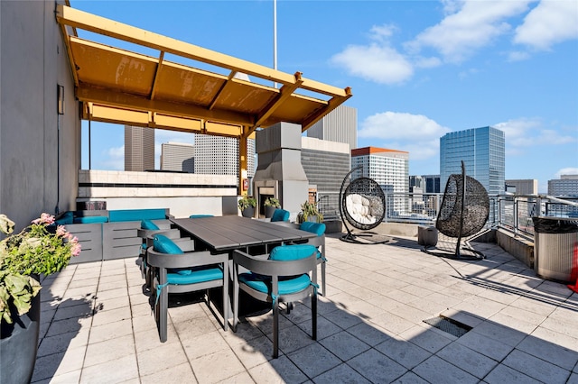 2000 Bagby St Unit 13430, Houston, TX 77002 - view of patio with a city view, outdoor dining area, and a pergola
