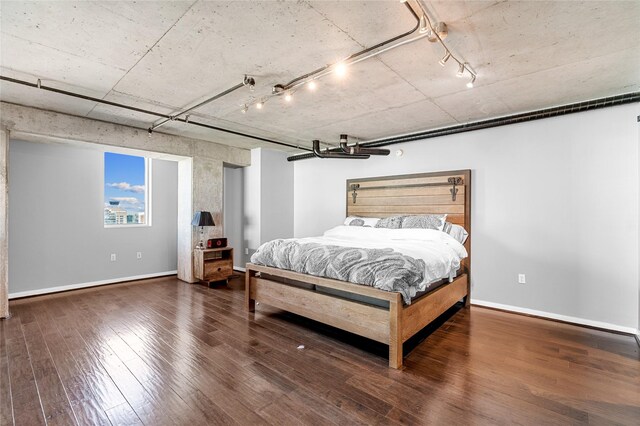 2000 Bagby St Unit 13430, Houston, TX 77002 - bedroom with track lighting, wood-type flooring, and baseboards