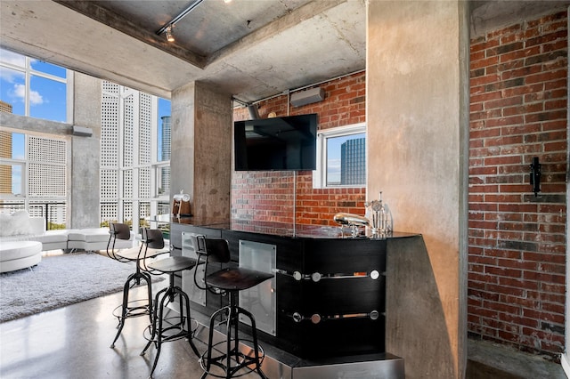 2000 Bagby St Unit 13430, Houston, TX 77002 - kitchen with concrete flooring and brick wall