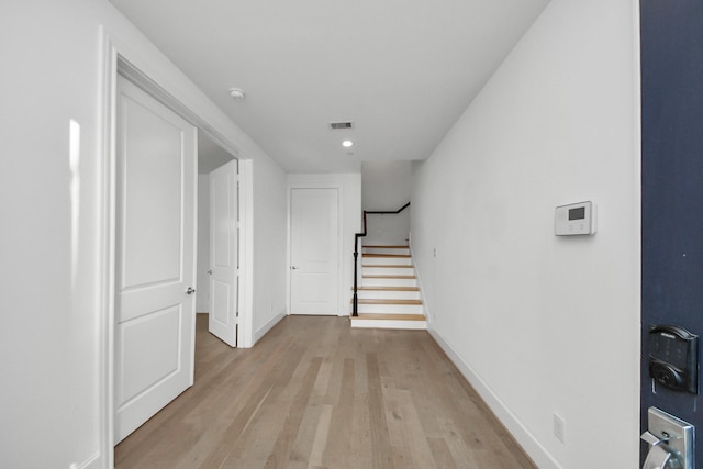 4005 Woodshire Village Ests, Houston, TX 77025 - corridor featuring light wood-style floors, baseboards, and stairway