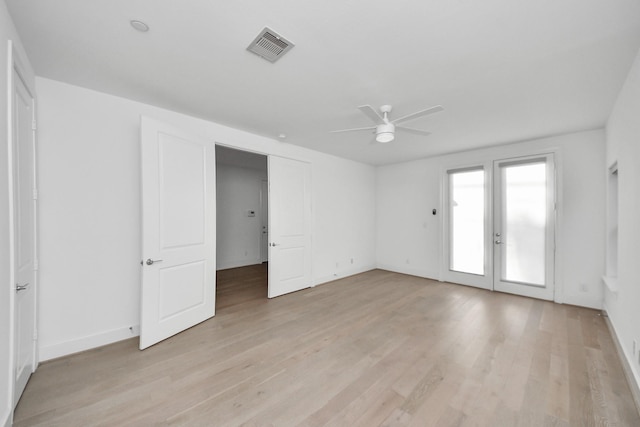4005 Woodshire Village Ests, Houston, TX 77025 - empty room featuring a ceiling fan, light wood-style floors, french doors, and baseboards